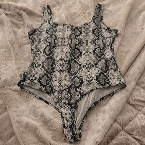 Beautiful soft body suit with snappy crotch fastening never worn size L